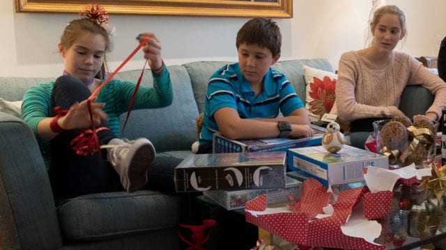 Photograph the fun on Christmas morning as the kid open presents.