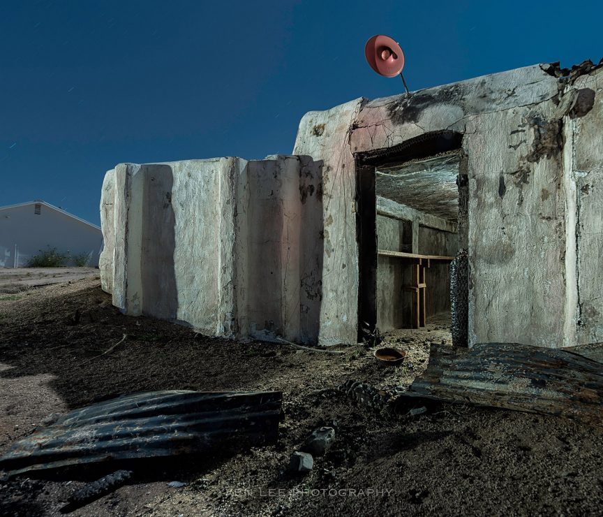 This is a night photo of what I believe may have been some ranch or farm property in the Mojave Preserve. The location was idyllic in a Mojave Desert sort of way, with rustic fences and barns and groves of Joshua Trees, most of which were now charred from the Dome Fire.