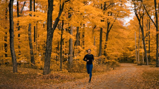 Female runner fall forest
