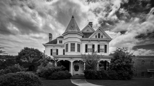 Black and white photo of Victorian house with perspective corrected in Luminar AI
